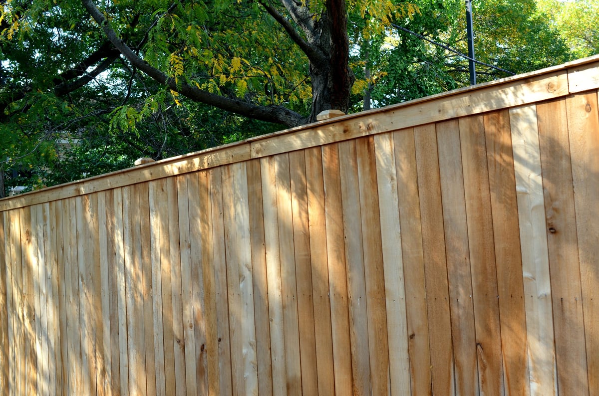 A wooden fence wall being built